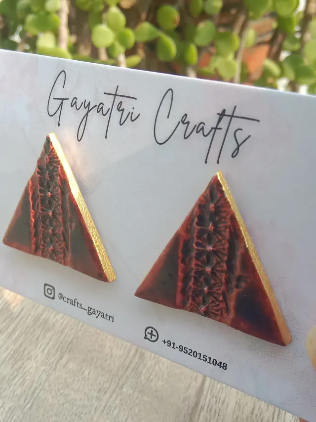 Brown Triangle Clay Studs With An Engraved Lacey Design And A Golden Border