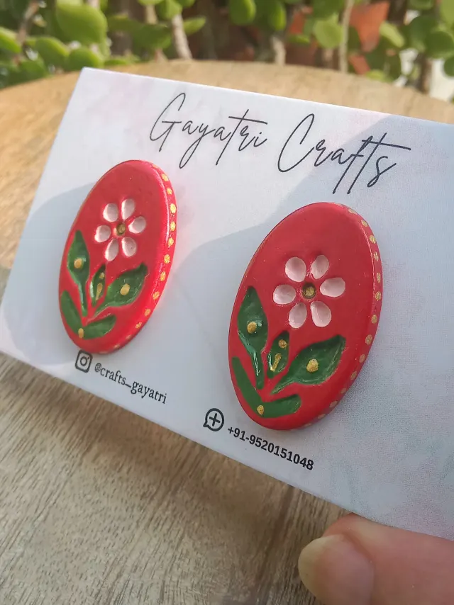 Oval Clay Studs With An Engraved Ethnic Floral Design In A Beautiful Red Colour