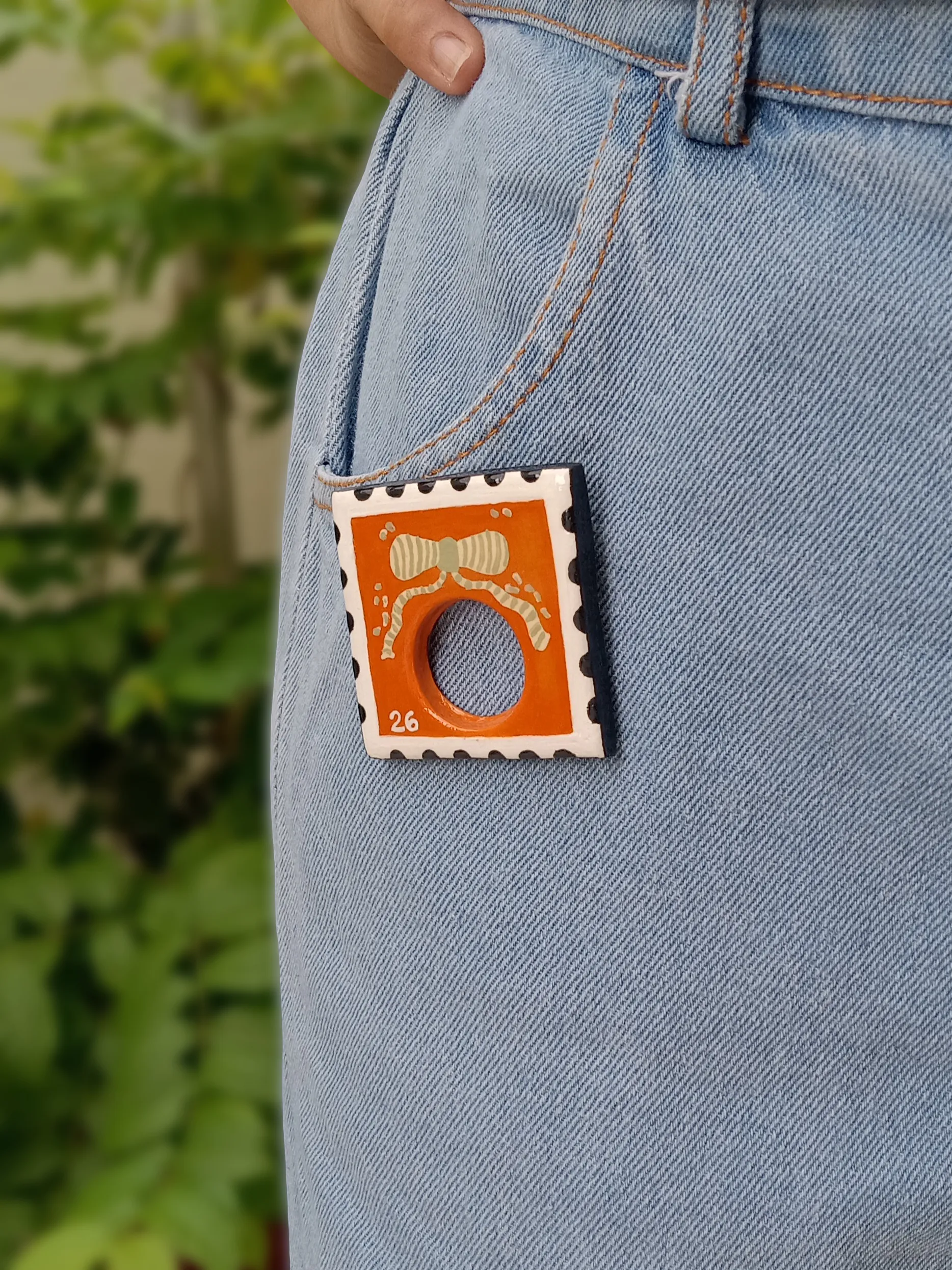 Handmade Bright Boho Orange Postage Stamp Clay Sunglasses Glasses Holder Brooch — Hand-Painted Bow Statement Reading Glasses Holder Brooch For Denims, Tote bags, Hand bags and Shirts