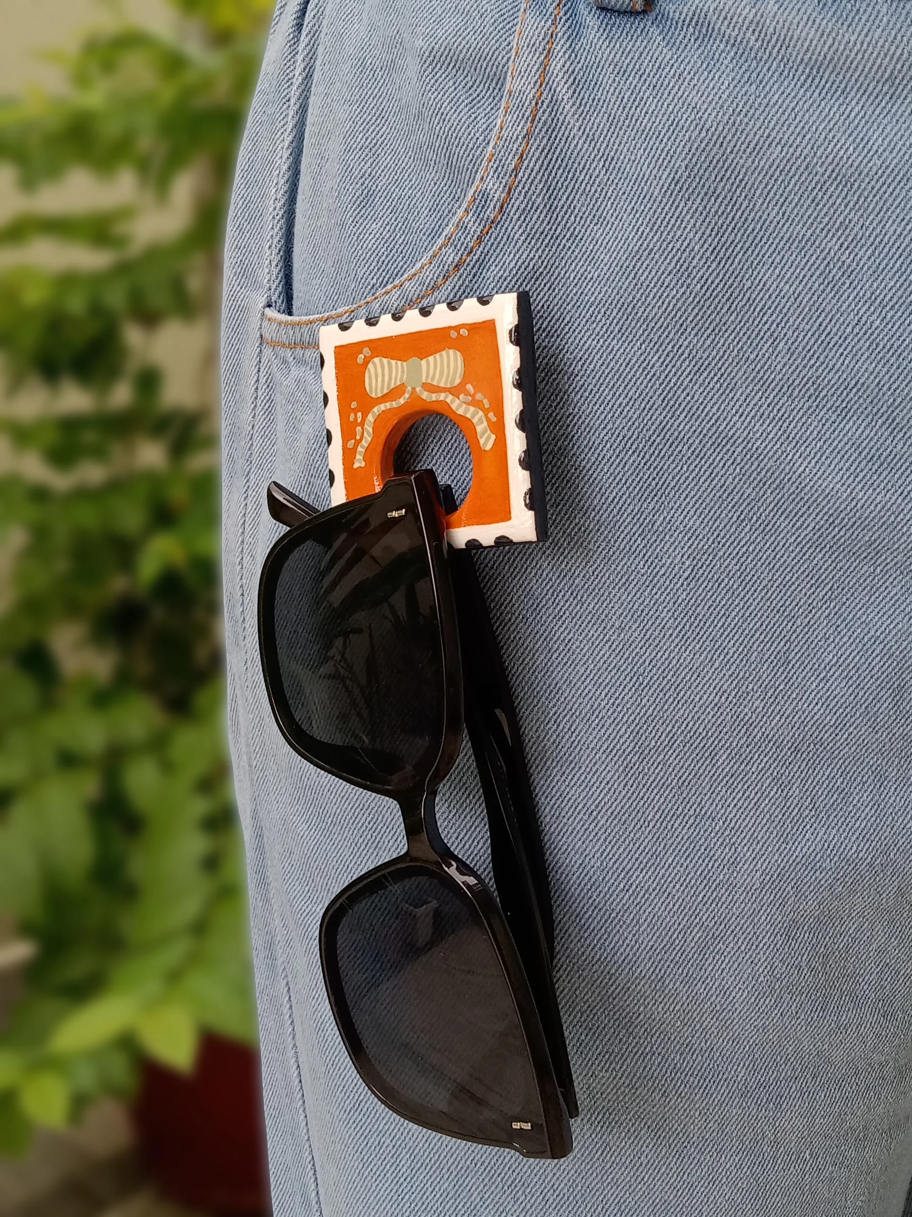Handmade Bright Boho Orange Postage Stamp Clay Sunglasses Glasses Holder Brooch — Hand-Painted Bow Statement Reading Glasses Holder Brooch For Denims, Tote bags, Hand bags and Shirts