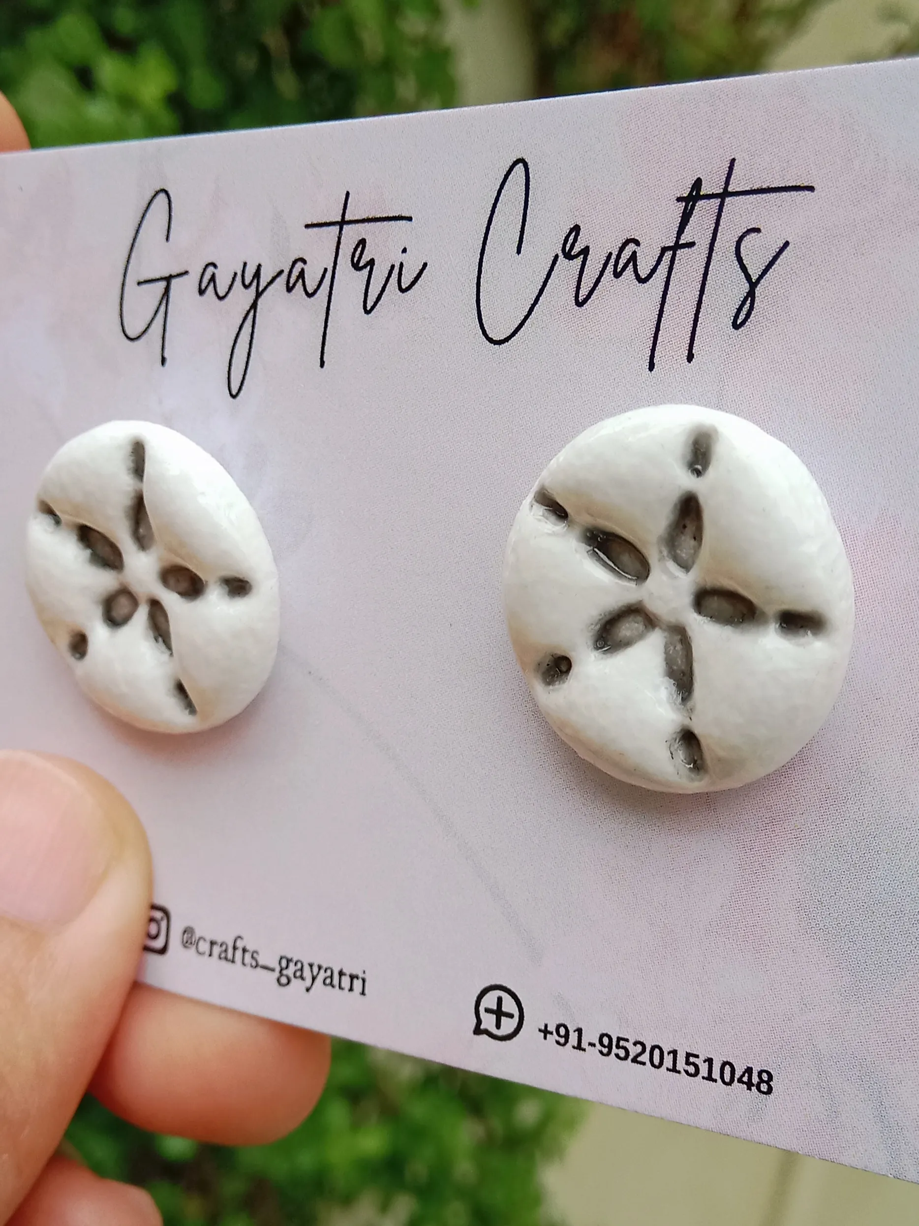 Macro shot showing the high-gloss Mont Marte glaze finish over the engraving on a white round stud earring.